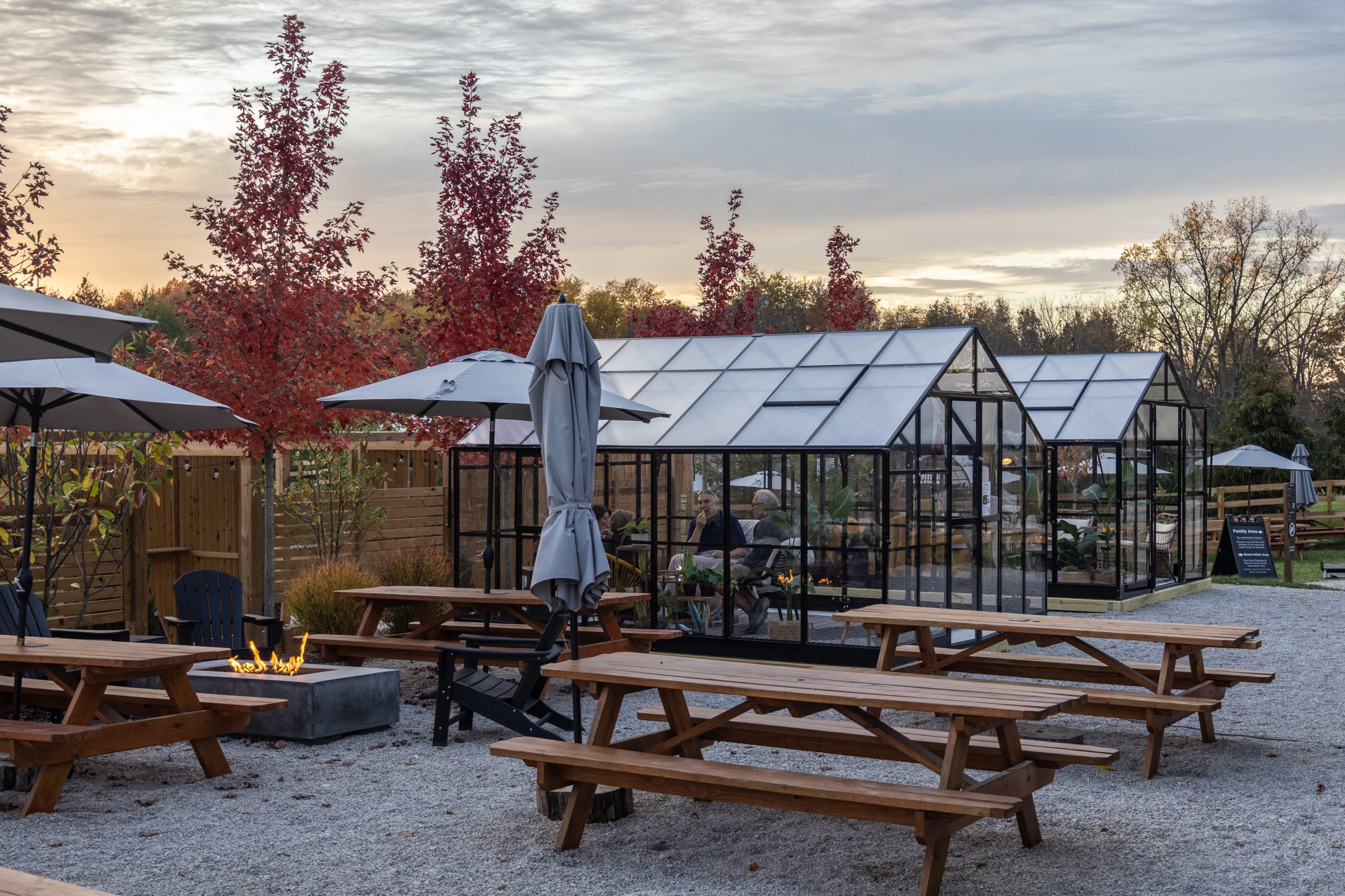 Taphouse Glass House The Vineyard Room at The Taphouse with natural light, wood interiors, and tables set for wine tasting or private events