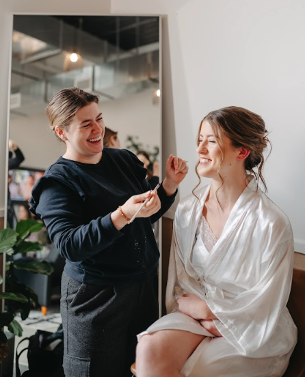 Bride getting her makeup done during wedding preparation at Retreat 21 near Columbus, Ohio
