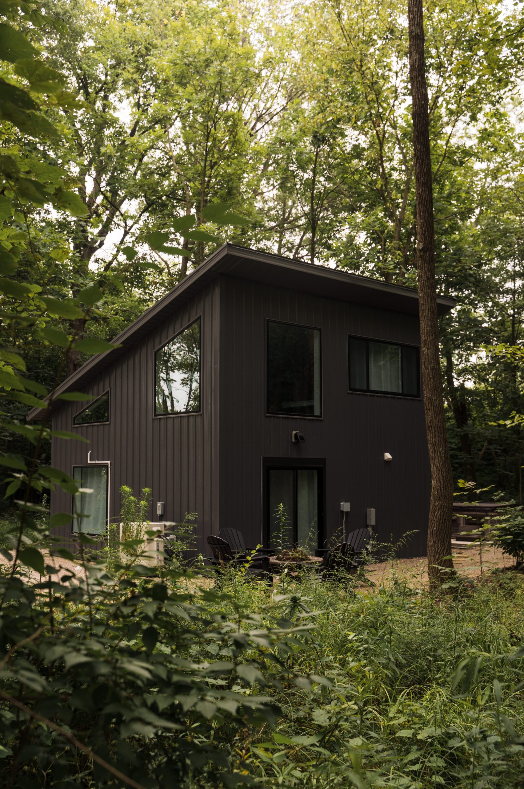 Guest Cabins in the Forest Cabin in the woods surrounded by greenery during summer at Retreat 21 near Columbus, Ohio