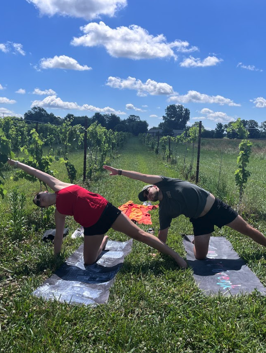 Group doing yoga outdoors near the vineyard at Retreat 21 near Columbus, Ohio