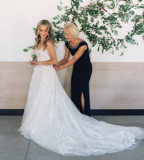 Mother helping the bride during wedding preparation at Retreat 21 near Columbus, Ohio