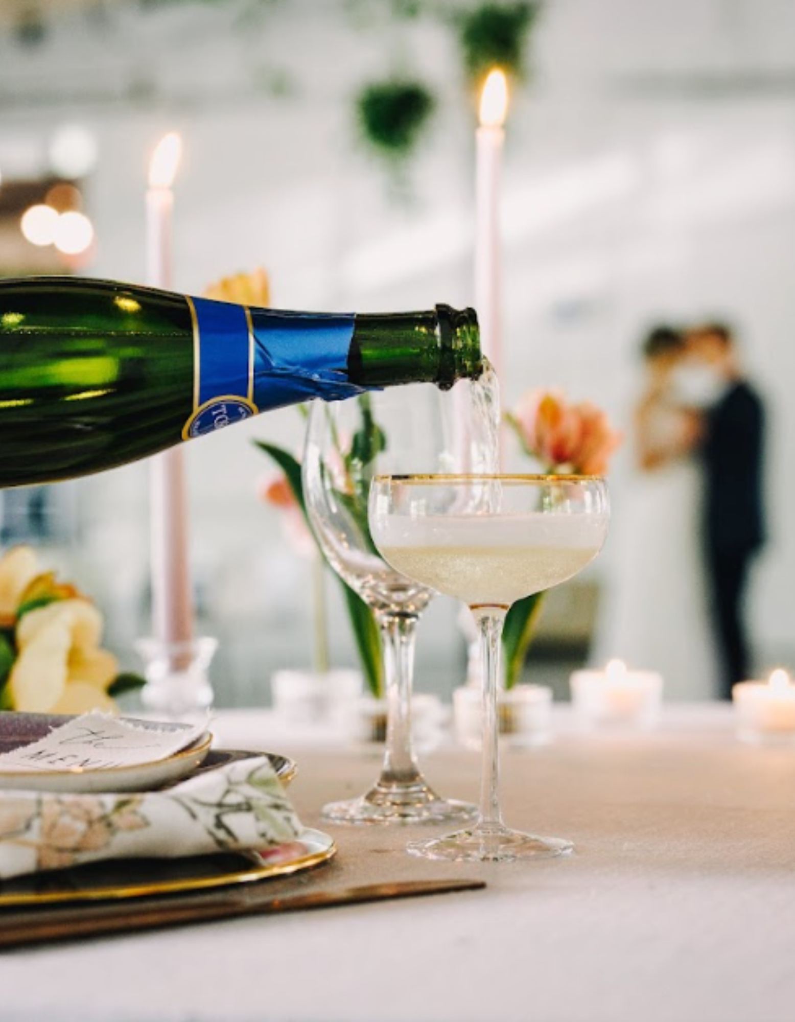 Champagne being poured into a glass during wedding celebration at Retreat 21 near Columbus, Ohio
