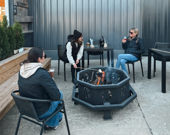 The Vineyard Room at The Taphouse with natural light, wood interiors, and tables set for wine tasting or private events