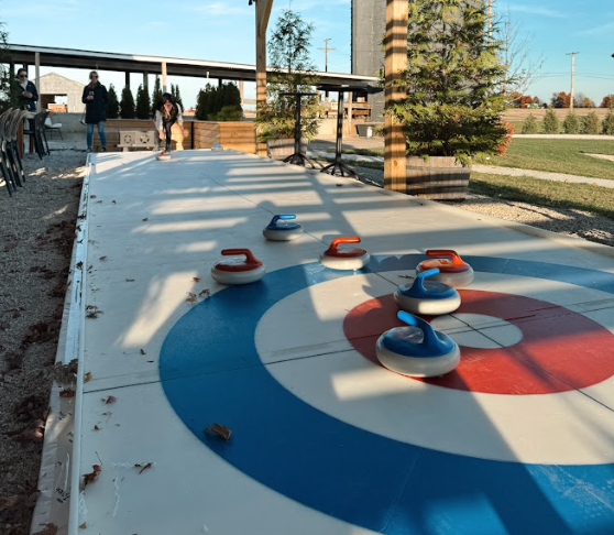 The Vineyard Room at The Taphouse with natural light, wood interiors, and tables set for wine tasting or private events