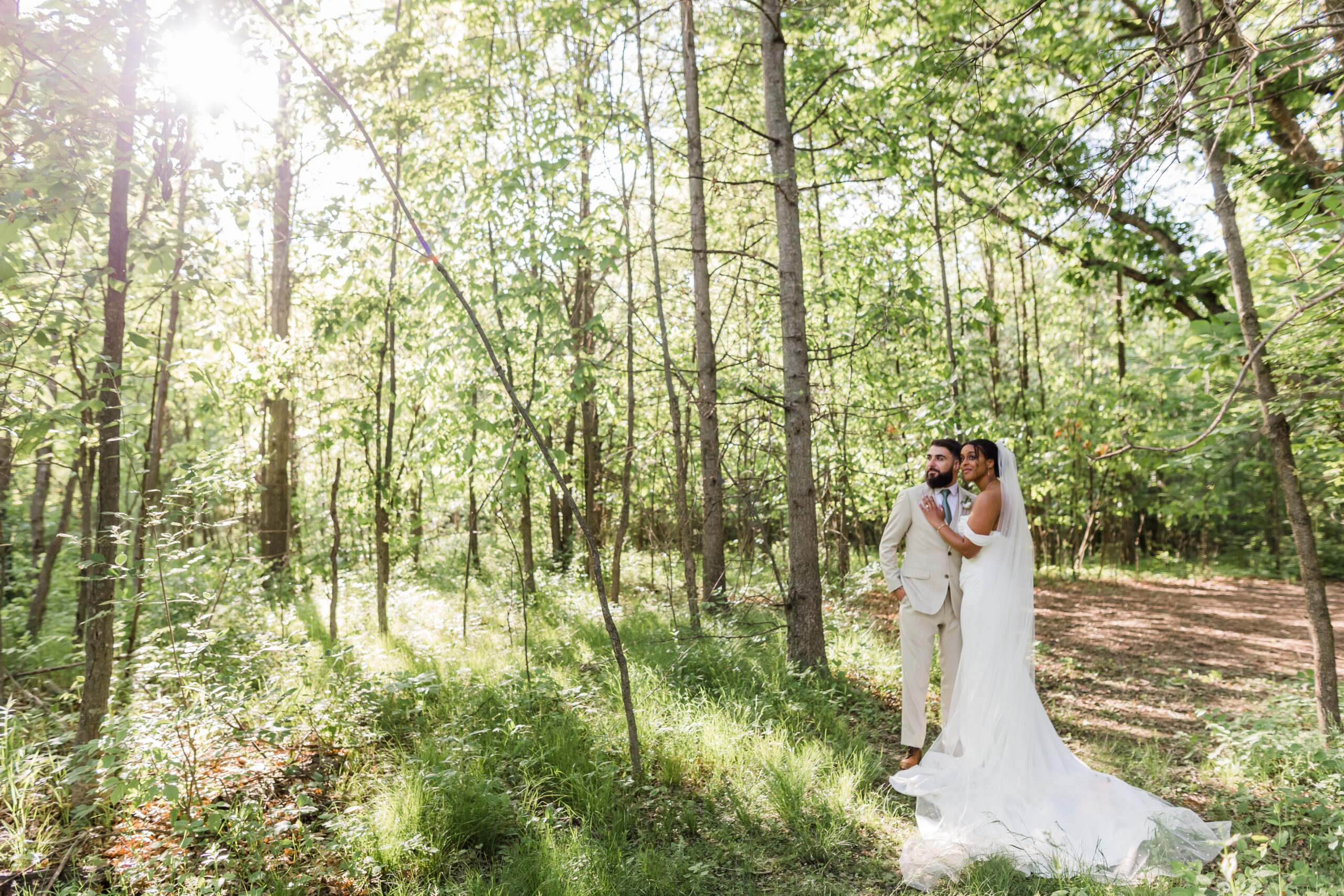 A corporate team participating in a collaborative outdoor activity in the natural swimming pond at Retreat 21 in Marysville, Ohio.