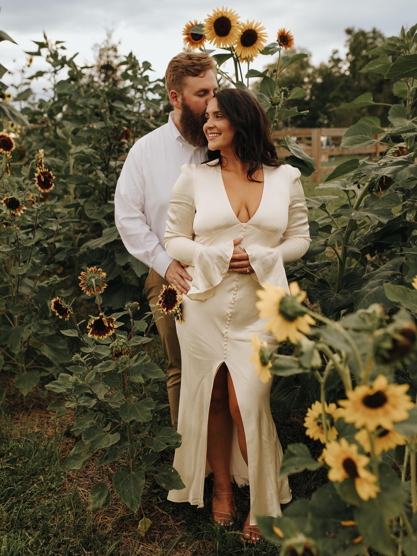 A group of professionals standing outside the Retreat 21 auditorium during a meeting break, showing the modern black-framed glass doors and wood siding.