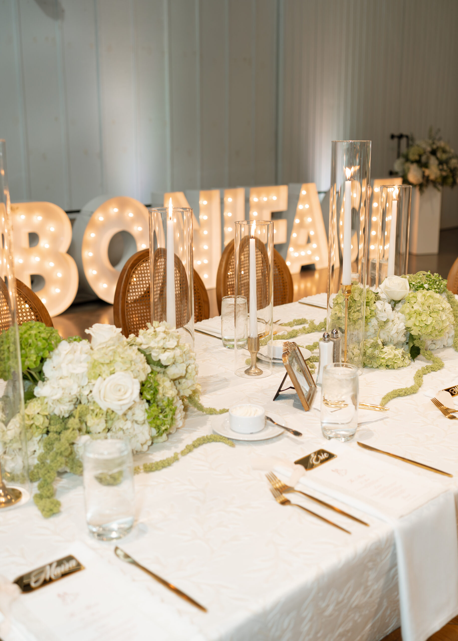 Retreat 21 Wedding - Emma & Austin Creative wedding reception table design with unique lighting elements at Retreat 21